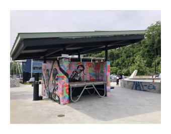 Mural by Egypt Hagan on skatepark pavilion