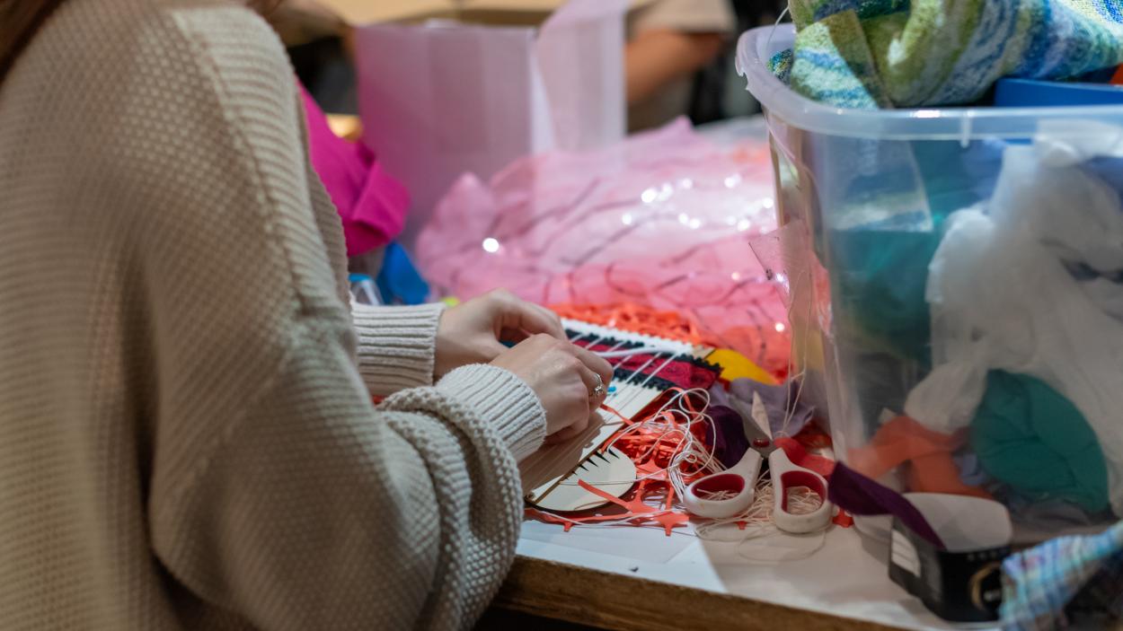 A child weaving 